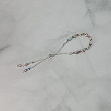 Load image into Gallery viewer, Sheet Music Slider Knot Paper Bead Bracelet w/ pink/blue glass spacer beads & silver music note charm