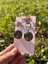 Load image into Gallery viewer, Black and orange shimmery floral huggie earrings
