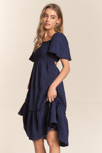 Load image into Gallery viewer, J.NNA Smocked Bow Back Ruffle Hem Dress
